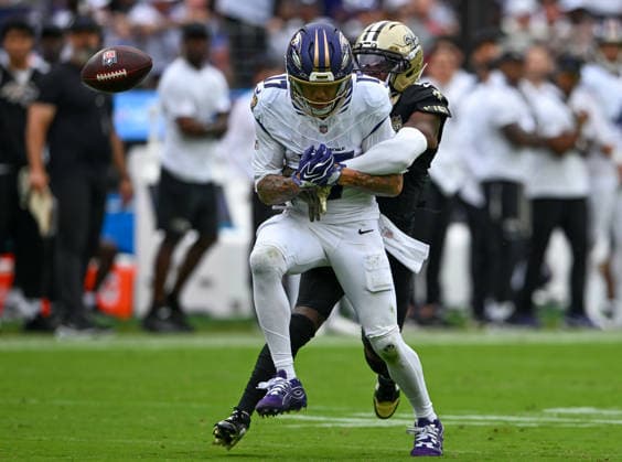 An attempted pass to Baltimore Ravens wide receiver Chris Moore (17) is blocked by New Orleans Saints cornerback Kool-Aid McKinstry (1) during the fourth quarter at M&T Bank Stadium in Baltimore, Maryland, on Sunday, September 20, 2026. The New Orleans Saints won 24-17.  BAL20260920145 DAVIDxTULIS
