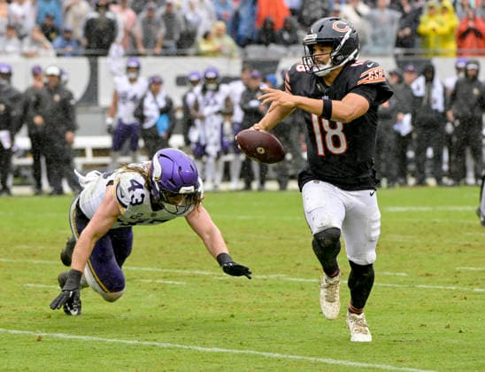 Chicago Bears quarterback Caleb Williams (18) runs the ball late in the fourth quarter moments before getting hurt on the play and take off on the field on cart against the Minnesota Vikings at Soldier Field in Chicago on Sunday, September 20, 2026. Vikings defeated the Bear 9-6.  CHI20260920120 MARKxBLACK