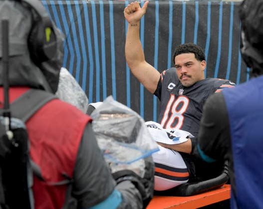 Chicago Bears quarterback Caleb Williams (18) gives the thumbs up as he is carted off the field after an injury late in the fourth quarter against the Minnesota Vikings at Soldier Field in Chicago on Sunday, September 20, 2026. Vikings defeated the Bear 9-6.  CHI20260920127 MARKxBLACK
