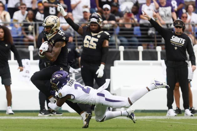 New Orleans Saints wide receiver Devaughn Vele (14) is tackled by Baltimore Ravens safety Jaylinn Hawkins (21) during an NFL, American Football Herren, USA game. Sep 20, 2026; Baltimore, MD, USA; at M&T Bank Stadium. New Orleans won 24-17. Mandatory Credit: -Cal Media Baltimore USA - ZUMAc04_ 20260920_zma_c04_203 Copyright: xMikexBuscherx