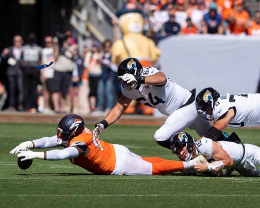 Sep 20, 2026; Denver Broncos defensive tackle Malcolm Roach (97) dives for a loose ball during the game between the Denver Broncos and Jacksonville Jaguars in Denver, CO, USA; at Empower Field at Mile High. Mandatory Credit: -Cal Media - ZUMAc04_ 20260920_zma_c04_255 Copyright: xDerekxRegensburgerx