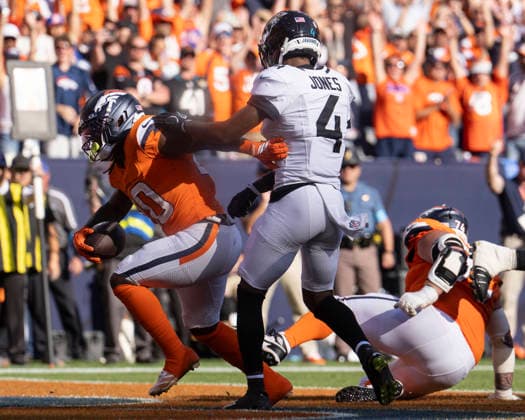 Sep 20, 2026; Denver Broncos running back Jonah Coleman (20) scores his first NFL, American Football Herren, USA touchdown during the game between the Denver Broncos and Jacksonville Jaguars in Denver, CO, USA; at Empower Field at Mile High. Mandatory Credit: -Cal Media - ZUMAc04_ 20260920_zma_c04_314 Copyright: xDerekxRegensburgerx
