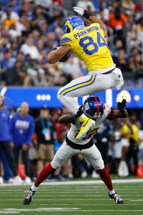 INGLEWOOD, CA - SEPTEMBER 21: Los Angeles Rams tight end Colby Parkinson (84) leaps over New York Giants cornerback Dru Phillips (22) during the NFL, American Football Herren, USA game between the New York Giants and the Los Angeles Rams on September 21, 2026, at SoFi Stadium in Inglewood, CA. (Photo by Jevone Moore Icon Sportswire) NFL: SEP 21 Giants at Rams EDITORIAL USE ONLY Icon260921877