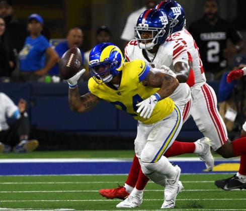 Los Angeles Rams running back Blake Corum recovers his own fumble in front of New York Giants safety Jev—n Holland on Monday Night Football at SoFi Stadium in Inglewood, California on Monday September 21, 2026.  LAP2026092111 JONxSOOHOO