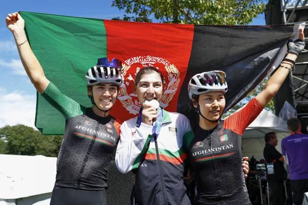 Aichi-Nagoya Asian Games: Cycling road Afghanistan s Fariba Hashimi (C) poses after winning the Aichi-Nagoya Asian Games women s cycling road race silver in Shinshiro in Aichi Prefecture, central Japan, on Sept. 22, 2026.  A14AA0005628247P