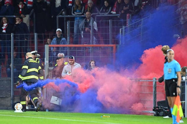 Smoke bombs were set off just before halftime; blue and red smoke rose during the Women s Champions League group stage match between FC Bayern Munich and Manchester City on September 22, 2026, at Sportpark Unterhaching.