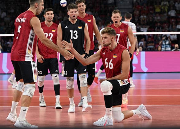 Poland And Germany Battle For Semifinal Spot At EuroVolley 2026 SOFIA, BULGARIA - SEPTEMBER 22: Erik Roehrs ( 66) of Germany kneels on the court floor to slap hands and celebrate with teammate Moritz Reichert ( 5) during their CEV Enel EuroVolley 2026 Men quarterfinal match at Arena 8888 Sofia in Sofia, Bulgaria, on September 22, 2026. Sofia Bulgaria  Copyright: xArturxWidakx originalFilename:widak-polandan260922_npagl.jpg
