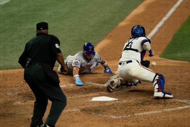 New York Mets Vs Texas Rangers - September 22, 2026 Francisco Alvarez of the New York Mets slides into home on a sacrifice fly during the game between the New York Mets and Texas Rangers at Globe Life Field in Arlington, Texas, on September 22, 2026. Arlington Texas United States  Copyright: xSethxGarberx originalFilename:garber-newyorkm260922_npdNL.jpg