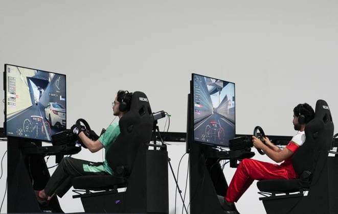 (260923) -- TOKONAME, Sept. 23, 2026 -- Naif Abdulhakim S Alfaleh (L) of Saudi Arabia competes during the esports auto racing Gran Turismo 7 final at the 20th Asian Games Aichi-Nagoya 2026 in Tokoname, Aichi Prefecture, Japan, Sept. 23, 2026. ) (SP)JAPAN-TOKONAME-ASIAN GAMES-ESPORTS-AUTO RACING-GRAN TURISMO 7-FINAL ZhangxHaobo 
