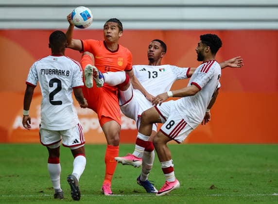 (260923) -- TOYOTA, Sept. 23, 2026 -- Zhang Yuning (2nd L) of China vies with Yousif Almarzooqi (2nd R) of the United Arab Emirates during the group B match of men s football between China and the United Arab Emirates at 20th Asian Games Aichi-Nagoya 2026 in Toyota of Aichi Prefecture, Japan, Sept. 23, 2026. ) (SP)JAPAN-TOYOTA-ASIAN GAMES-FOOTBALL-MEN S GROUP-CHN VS UAE JiaxHaocheng 