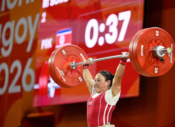 (260923) -- NAGOYA, Sept. 23, 2026 -- Ri Song Gum of the Democratic People s Republic of Korea competes during the women s 49kg final of weightlifting at the 20th Asian Games Aichi-Nagoya 2026 in Nagoya, Japan, Sept. 23, 2026. ) (SP)JAPAN-NAGOYA-ASIAN GAMES-WEIGHTLIFTING-WOMEN S 49KG YuxYang 