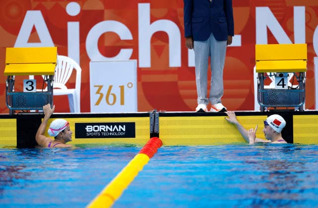 (260923) -- TOKYO, Sept. 23, 2026 -- Zhang Yufei (R) and Yu Yiting of China react after the women s 100m butterfly final at the 20th Asian Games Aichi-Nagoya 2026 in Tokyo, Japan, Sept. 23, 2026. ) (SP)JAPAN-TOKYO-ASIAN GAMES-SWIMMING-WOMEN S 100M BUTTERFLY WuxZhizun 