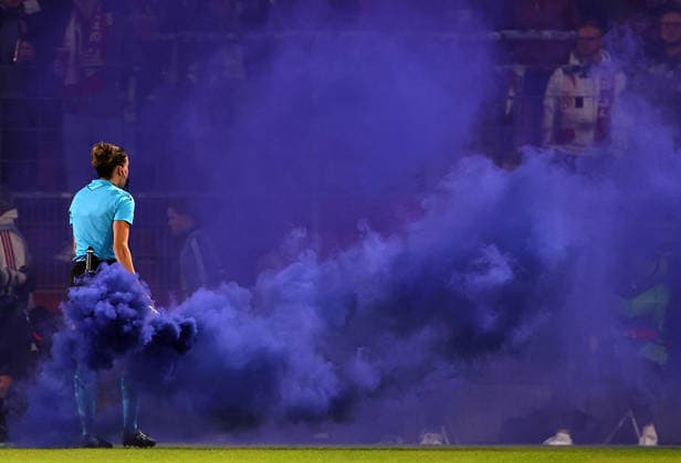 Football Women Uefa Champions League 2026 - 2027 Bayern Munchen vs Manchster City Fans throw smoke bombs onto the pitch and the referee Olatz Rivera Olmedo take it away during the Women Uefa Champions League 2026 - 2027 football match between Bayern Munchen and Manchester City at Sportpark Stadium in Unterhaching , Bayern , Germany . September 22th , 2026 Copyright: xDavidexEliasx