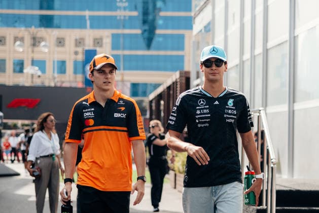 FORMULA 1 QATAR AIRWAYS AZERBAIJAN GRAND PRIX 2026 Oscar Piastri (McLaren Formula 1 Team, 81) and George Russell (Mercedes AMG Petronas Formula One Team, 63) walking in the paddock on media day at the Azerbaijan GP 2026 23 09 2026