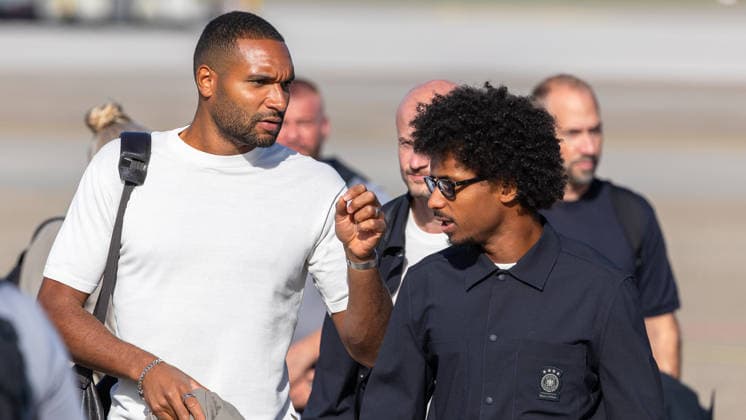 Departure of the German DFB national soccer team for Amsterdam for the Nations League match against the Netherlands, Nuremberg, September 23, 2026. Jonathan Tah and Karim Adeyemi arrive on the tarmac for the German national soccer team’s departure to Amsterdam. In the background, other members of the delegation wait. Nuremberg, Bavaria, Germany 20260923-1V9A9015-M4000
