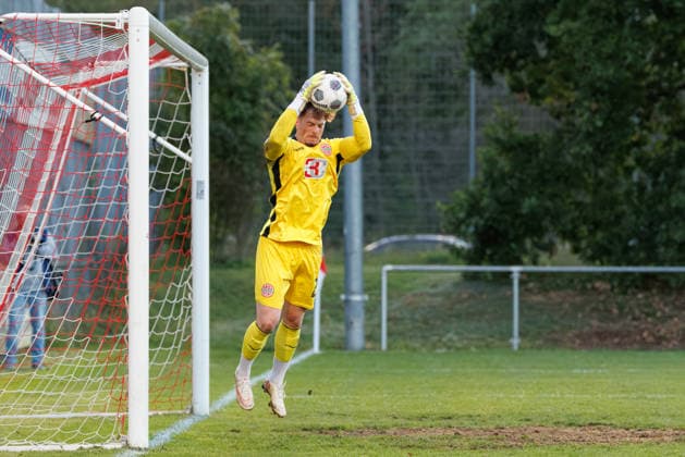 Maurice Merkl, 22, of TSV Landsberg holds the ball securely during the match between TSV Landsberg and FC Ingolstadt 04, soccer, men s, Toto Cup, 2026–2027, Quarterfinals on September 23, 2026, in Landsberg am Lech, Sportpark Bayern, Germany