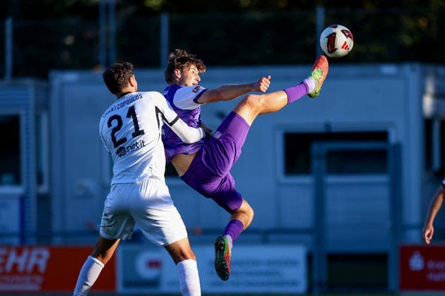 September 23, 2026, xkwix, soccer, exhibition match, SC Wiedenbrück vs. VfL Osnabrück, Jahnstadion, exhibition match, 2026–2027 Season: Charalampos Chantzopoulos (SC Wiedenbrück 21) in a tackle against Bernd Riesselmann (VfL Osnabrück 22), who is suspended in mid-air. DFB regulations prohibit any use of photographs as image sequences and or quasi-video. Photo: xKamilxWilkowskixPress Photo Kochx North Rhine-Westphalia, Germany