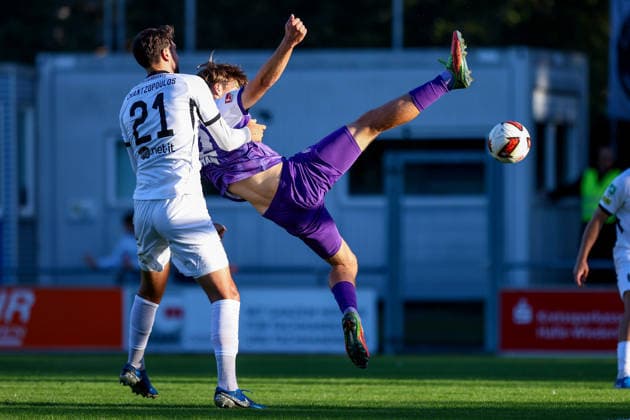 September 23, 2026, xkwix, soccer, exhibition match, SC Wiedenbrück vs. VfL Osnabrück, Jahnstadion, exhibition match, 2026–2027 Season: Charalampos Chantzopoulos (SC Wiedenbrück 21) in a tackle against Bernd Riesselmann (VfL Osnabrück 22), who is suspended in mid-air. DFB regulations prohibit any use of photographs as image sequences and or quasi-video. Photo: xKamilxWilkowskixPress Photo Kochx North Rhine-Westphalia, Germany