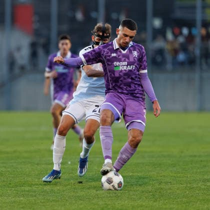 Ognjen Drakulic, 30, FC Ingolstadt 04 in the background; Kilian Pittrich, 21, TSV Landsberg, during the match between TSV Landsberg and FC Ingolstadt 04, soccer, men s, Toto Cup, 2026–2027, quarterfinals on September 23, 2026, in Landsberg am Lech, Sportpark Bayern, Germany