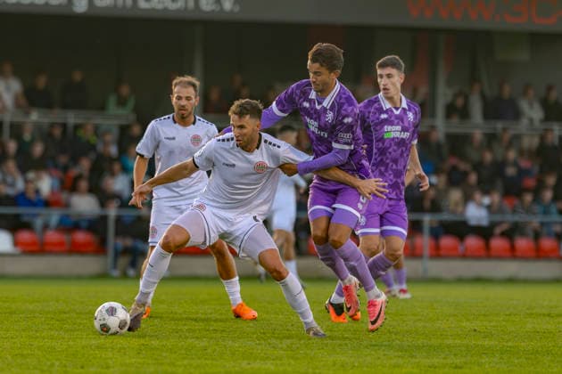 Landsberg, Germany, September 23, 2026 Toto Cup (Bavarian State Cup) 2026–2027 Quarterfinals: TSV 1882 Landsberg vs. FC Ingolstadt 04. Pictured, from left, in a tackle: Marco Luburic of TSV 1882 Landsberg and Frederik Carlsen (FCI) in a tackle at TSV Sportpark Bayern Copyright: xFotostandx xSchäferx