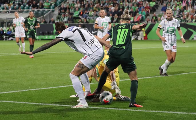 Here, Svenja Huth of VfL Wolfsburg scores the 4-0 goal against Sarah Lisa Duebel and Lilla Sipos of SK Sturm Graz. Soccer, Women, 2026–2027 Season, UEFA Women’s Europa Cup Qualifiers, Round 2, AOK Stadium Wolfsburg, VfL Wolfsburg vs. Sturm Graz