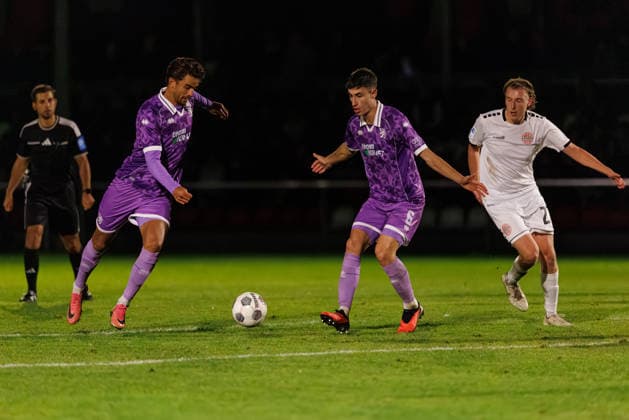 Fredrik Carlsen 8, FC Ingolstadt 04; Georgios Antzoulas 6, FC Ingolstadt 04; and Luis Schäffler 27, TSV Landsberg, in the match between TSV Landsberg and FC Ingolstadt 04, soccer, men s, Toto Cup, 2026–2027, Quarterfinals on September 23, 2026, in Landsberg am Lech, Sportpark Bayern, Germany