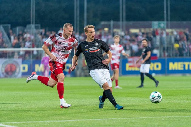 Eric Hottmann, Fortuna Düsseldorf 09, and Danny Alkenbach, Schwarz Weiss 09 36 Oberhausen Alstaden, 07 in a tackle during the Fortuna Düsseldorf vs. Schwarz Weiss Alstaden match, soccer, Lower Rhine Cup, 2nd round, 2026–27 season, September 23, 2026, DFL regulations prohibit any use of photographs as image sequences and or quasi-video. Fortuna Düsseldorf vs. Schwarz Weiss Alstaden, soccer, Lower Rhine Cup, Round 2, 2026–27 season, September 23, 2026, Düsseldorf Copyright: xEibner-Pressefoto LukasxBaldygax EP_LBA