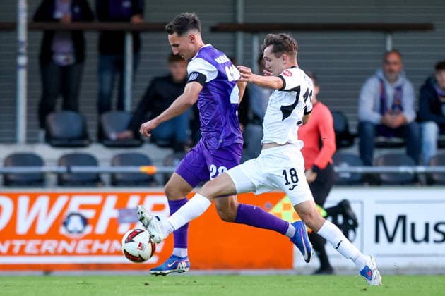 September 23, 2026, xkwix, soccer, exhibition match, SC Wiedenbrück vs. VfL Osnabrück, Jahnstadion, exhibition match, 2026–2027 season: Konrad Faber (VfL Osnabrück, No. 28) in a tackle against Timo Arnold (Kondziella, SC Wiedenbrück, No. 18). DFB regulations prohibit any use of photographs as image sequences and or quasi-video. Photo: xKamilxWilkowskixPressefotoKochx North Rhine-Westphalia, Germany