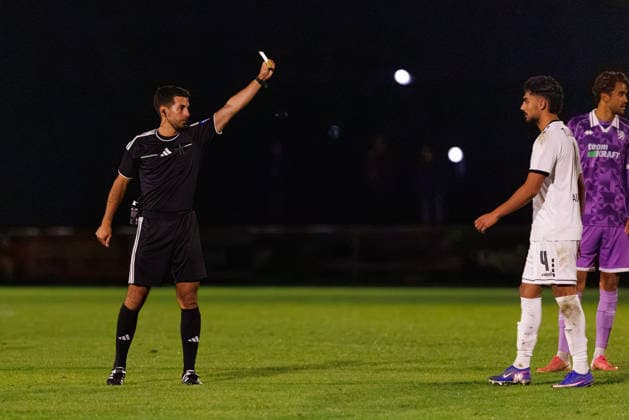 Referee Maximilian Riedel shows Benito Alisanovic (No. 4, TSV Landsberg) a yellow card during the match between TSV Landsberg and FC Ingolstadt 04, soccer, men s, Toto Cup, 2026–2027, Quarterfinals on September 23, 2026, in Landsberg am Lech, Sportpark Bayern, Germany