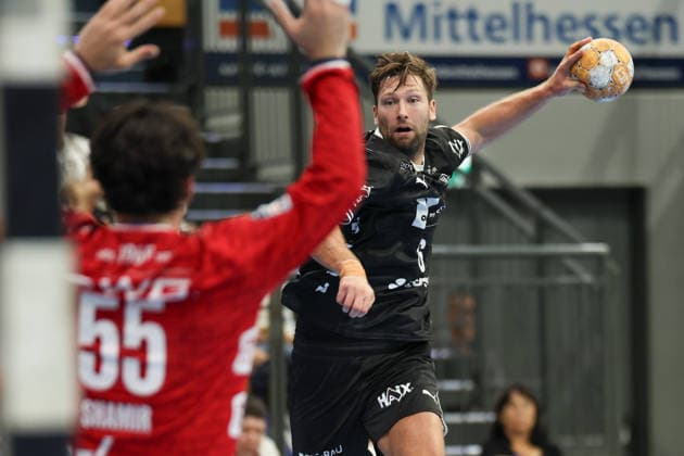 TV Hüttenberg vs. THW Kiel, DHB Cup: Harald Reinkind of THW Kiel, No. 6, shoots at the goal defended by Yahav Shamir of TV Hüttenberg, 55th DHB Cup match of the second round between TV Hüttenberg and THW Kiel on September 23, 2026, at the Buderus Arena in Wetzlar, Wetzlar, Hesse, Germany; Buderus Arena