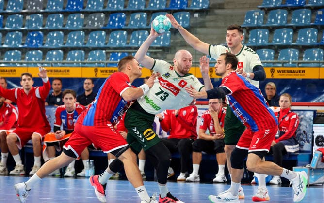 September 23, 2026, Germany, Bietigheim, DHB Handball Cup, 2026–2027 Season: SG BBM Bietigheim vs. GWD Minden; from left: Fabian Wiederstein (BBM), Alexander Weck (GWD), Dominik Claus (BBM), Mika Laurin Sajenev (GWD)