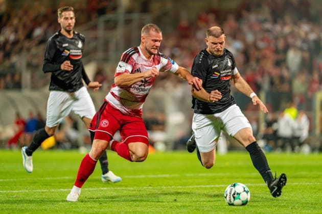 Eric Hottmann of Fortuna Düsseldorf, 09, in a tackle with Ardit Zeqiri of Schwarz Weiss 09 36 Oberhausen Alstaden, 04, fighting for the ball; Fortuna Düsseldorf vs. Schwarz Weiss Alstaden, soccer, Lower Rhine Cup, 2nd round, 2026–27 season, September 23, 2026, DFL regulations prohibit any use of photographs as image sequences and or quasi-video; Fortuna Düsseldorf vs. Schwarz Weiss Alstaden, soccer, Lower Rhine Cup, 2nd round, 2026–27 season, September 23, 2026, Düsseldorf Copyright: xEibner-Pressefoto LukasxBaldygax EP_LBA