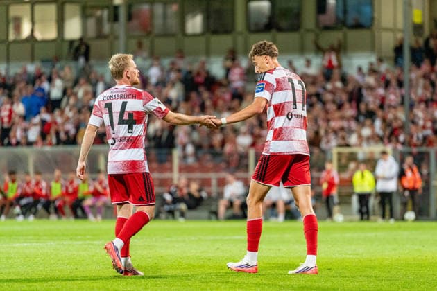 Jomaine Consbruch of Fortuna Düsseldorf (No. 14) and Lukas Eixler of Fortuna Düsseldorf (No. 11) high-five after a goal in the match between Fortuna Düsseldorf and Schwarz Weiss Alstaden, soccer, Lower Rhine Cup, 2nd round, 2026–27 season, September 23, 2026, DFL regulations prohibit any use of photographs as image sequences and or quasi-video. Fortuna Düsseldorf vs. Schwarz-Weiß Alstaden, soccer, Lower Rhine Cup, 2nd round, 2026–27 season, September 23, 2026, Düsseldorf Copyright: xEibner-Pressefoto LukasxBaldygax EP_LBA