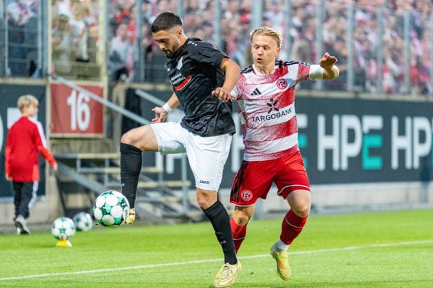 Wassim Jabri, Schwarz Weiss 09 36 Oberhausen Alstaden, No. 11 in a tackle with Andreas Mueller of Fortuna Düsseldorf, 06 Fortuna Düsseldorf vs. Schwarz Weiss Alstaden, Soccer, Lower Rhine Cup, 2nd Round, 2026–27 Season, September 23, 2026, DFL regulations prohibit any use of photographs as image sequences and or quasi-video. Fortuna Düsseldorf vs. Schwarz Weiss Alstaden, soccer, Lower Rhine Cup, 2nd round, 2026–27 season, September 23, 2026, Düsseldorf Copyright: xEibner-Pressefoto LukasxBaldygax EP_LBA