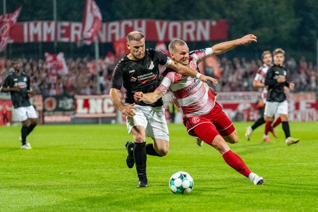 Ardit Zeqiri, Schwarz Weiss 09 36 Oberhausen Alstaden, No. 4 in a duel with Eric Hottmann of Fortuna Düsseldorf, 09 Fortuna Düsseldorf vs. Schwarz Weiss Alstaden, Soccer, Lower Rhine Cup, 2nd Round, 2026–27 Season, September 23, 2026, DFL regulations prohibit any use of photographs as image sequences and or quasi-video, Fortuna Düsseldorf vs. Schwarz Weiss Alstaden, soccer, Lower Rhine Cup, 2nd round, 2026–27 season, September 23, 2026, Düsseldorf Copyright: xEibner-Pressefoto LukasxBaldygax EP_LBA