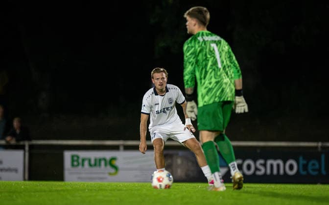Soccer, 2026–2027 Season, Lower Rhine Cup, September 23, 2026, Round 2, Men’s, BW Dingden White vs. SF Baumberg Blue; from left: Joshua Mueller (BW Dingden), Hannes Kramp (goalkeeper, SF Baumberg), Hamminkeln Sports Field, BW Dingden, Germany 260923_fb_bw-dingden_sf-baumberg_59160