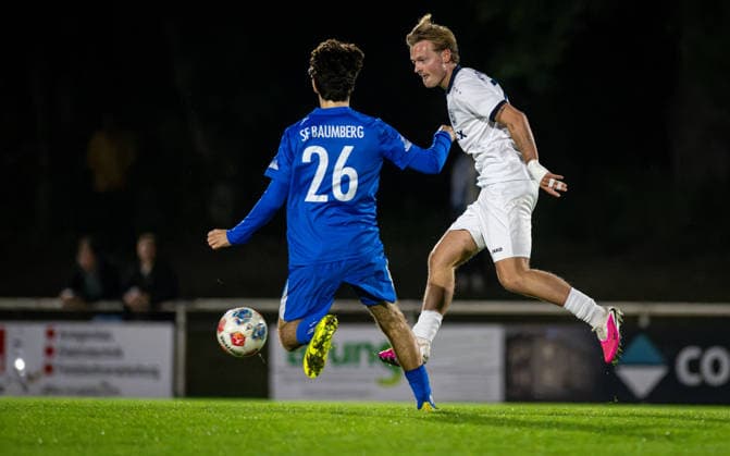 Soccer, 2026–2027 Season, Lower Rhine Cup, September 23, 2026, Round 2, Men’s, BW Dingden White vs. SF Baumberg Blue; from left: Millan Burovac (SF Baumberg), Joshua Mueller (BW Dingden); Hamminkeln Sports Field, BW Dingden, Germany 260923_fb_bw-dingden_sf-baumberg_59167