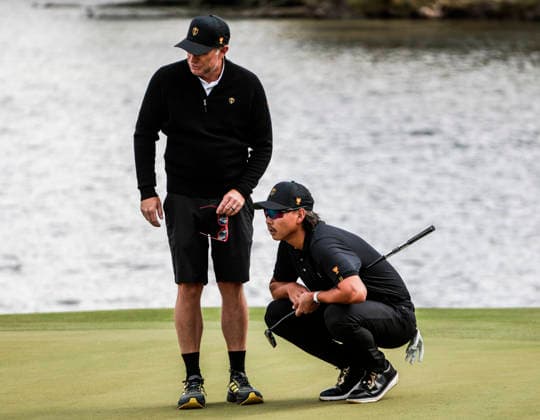 International team member Min Woo Lee of Australia (R) looks over the sixteenth green during practice for the Presidents Cup golf tournament at Medinah Country Club in Medinah, Illinois on Wednesday, September 23, 2026. Competition between the USA and the International team begins on Thursday, September 24 with Four-Ball play.  MED20260923810 TANNENxMAURY