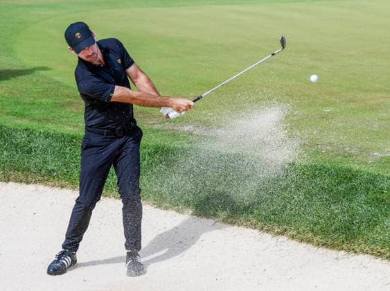 International team member Nick Taylor of Canada hits from a sand trap by the sixteenth green during practice for the Presidents Cup golf tournament at Medinah Country Club in Medinah, Illinois on Wednesday, September 23, 2026. Competition between the USA and the International team begins on Thursday, September 24 with Four-Ball play.  MED20260923825 TANNENxMAURY