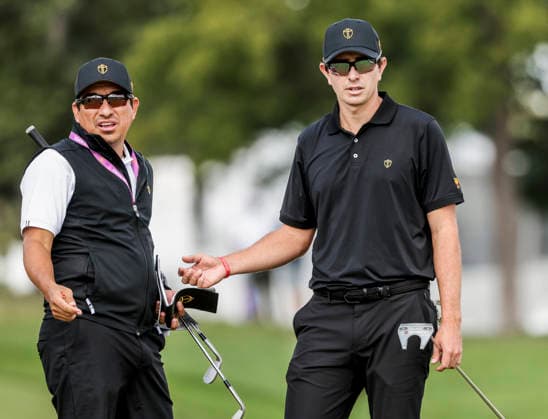 International team member Nico Echavarria of Colombia (R) stands with his caddie on the fifteenth green as he practices for the Presidents Cup golf tournament at Medinah Country Club in Medinah, Illinois on Wednesday, September 23, 2026. Competition between the USA and the International team begins on Thursday, September 24 with Four-Ball play.  MED20260923806 TANNENxMAURY