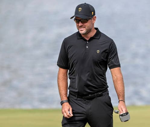 International team member Corey Conners of Canada carries his putter as he walks across the sixteenth green during practice for the Presidents Cup golf tournament at Medinah Country Club in Medinah, Illinois on Wednesday, September 23, 2026. Competition between the USA and the International team begins on Thursday, September 24 with Four-Ball play.  MED20260923819 TANNENxMAURY