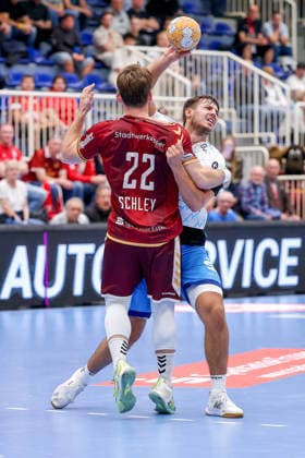 September 23, 2026, 2nd Round of the DHB Cup, TuSEM Essen 1 vs. VfL Potsdam: Nicholas Schley (TuSEM Essen 22) pins Markus Mahr (VfL Potsdam 06) at the circle; North Rhine-Westphalia, Germany
