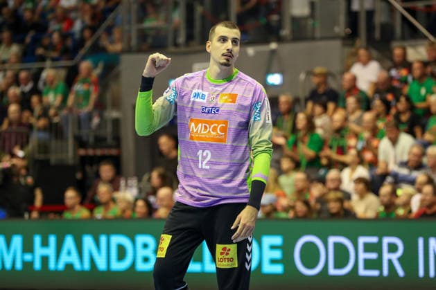 September 23, 2026, xgox, Handball DHB Cup, 2nd Round: SC Magdeburg vs. HSG Wetzlar, emspor; from left: Matej Mandic (Magdeburg), 12 celebrating a saved shot; blocked, saved; Magdeburg goalkeeper