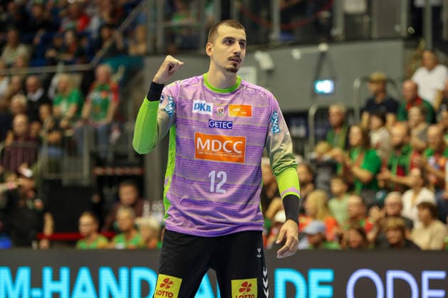 September 23, 2026, xgox, Handball DHB Cup, 2nd Round: SC Magdeburg vs. HSG Wetzlar, emspor; from left: Matej Mandic (Magdeburg), 12 celebrating a saved shot; blocked, saved; Magdeburg goalkeeper
