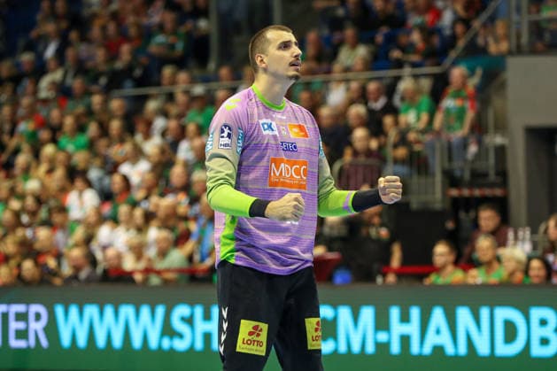 September 23, 2026, xgox, Handball DHB Cup, 2nd Round: SC Magdeburg vs. HSG Wetzlar, emspor; from left: Matej Mandic (Magdeburg), 12 celebrating a saved shot; blocked, saved; Magdeburg goalkeeper