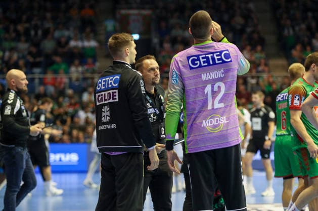 September 23, 2026, xgox, Handball DHB Cup, 2nd Round: SC Magdeburg vs. HSG Wetzlar emspor, from left: Dominik Kuzmanovic (Magdeburg), 1, Dino Spiranec (Magdeburg), goalkeeper coach, Matej Mandic (Magdeburg), 12 (Magdeburg)
