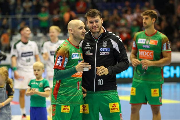 September 23, 2026, xgox, Handball DHB Cup, Round 2: SC Magdeburg vs. HSG Wetzlar, emspor; from left: Daniel Pettersson (Magdeburg), 11; Elvar Oern Jonsson (Magdeburg), 19; Celebrating the victory, Celebrations after the game in Magdeburg