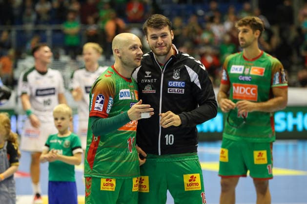 September 23, 2026, xgox, Handball DHB Cup, Round 2: SC Magdeburg vs. HSG Wetzlar, emspor; from left: Daniel Pettersson (Magdeburg), 11; Elvar Oern Jonsson (Magdeburg), 19; Celebrating the victory, Celebrations after the game in Magdeburg