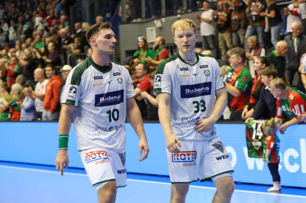 September 23, 2026, xgox, Handball DHB Cup 2nd Round SC Magdeburg vs. HSG Wetzlar emspor, from left: Josip Simic (Wetzlar), 10; Georg Löwen (Wetzlar), 33; looking disappointed, dejected, disappointed (Magdeburg)