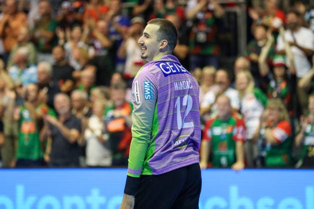September 23, 2026, xgox, Handball DHB Cup, 2nd Round: SC Magdeburg vs. HSG Wetzlar, emspor; from left: Matej Mandic (Magdeburg), 12 celebrating a saved shot, blocked, saved; Magdeburg goalkeeper